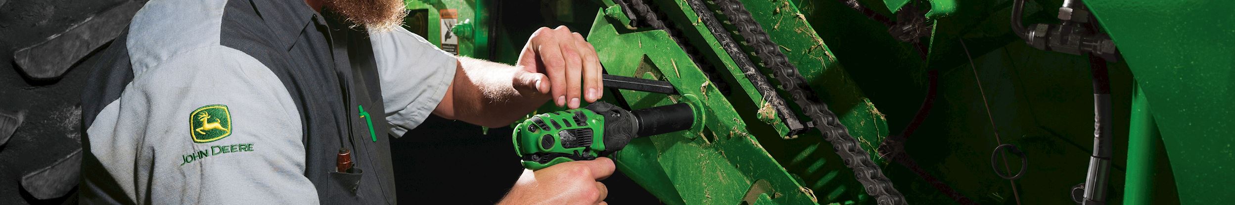 Carrico service technician working on machinery